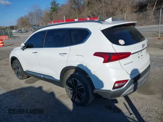 2019 Hyundai Santa Fe Ultimate with VIN 5NMS5CAA9KH012167, listed as a IAAI auction lot 41614279 with 100,925 mi miles and . Bid and sale history available at DreamBid. Image 3.