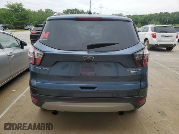 2018 Ford Escape Titanium with VIN 1FMCU9J93JUC01903, listed as a Copart auction lot 57337045 with 59,276 mi miles and Salvage title. Bid and sale history available at DreamBid. Image 6.