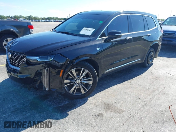 2020 Cadillac XT6 FWD Premium Luxury with VIN 1GYKPCRS7LZ211197, listed as a IAAI auction lot 42231424 with 57,351 mi miles and . Bid and sale history available at DreamBid. Image 18.