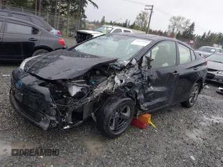 2022 Toyota Prius L Eco with VIN JTDKAMFU2N3154674, listed as a IAAI auction lot 41977505 with 61,552 mi miles and . Bid and sale history available at DreamBid. Image 2.