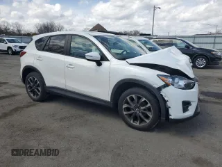 2016 Mazda CX-5 Grand Touring z VIN JM3KE2DY9G0645141, wystawiony jako Copart lot #50989635 z przebiegiem 123 898 mil mil oraz Szkoda całkowita • Salvage title. Historia ofert i sprzedaży dostępna na DreamBid. Obrazek 4.
