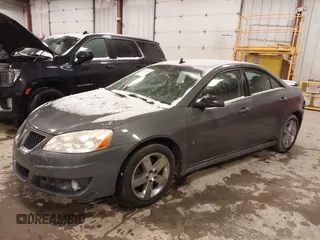 2009 Pontiac G6 1SB z VIN 1G2ZJ57KX94267343, wystawiony jako IAAI lot #41514632 z przebiegiem 164 061 mil mil oraz . Historia ofert i sprzedaży dostępna na DreamBid. Obrazek 2.