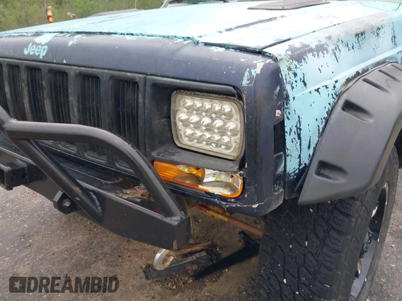 1997 Jeep Cherokee SE z VIN 1J4FJ28S3VL573144, wystawiony jako IAAI lot #41965201 z przebiegiem 298 276 mil mil oraz . Historia ofert i sprzedaży dostępna na DreamBid. Obrazek 20.