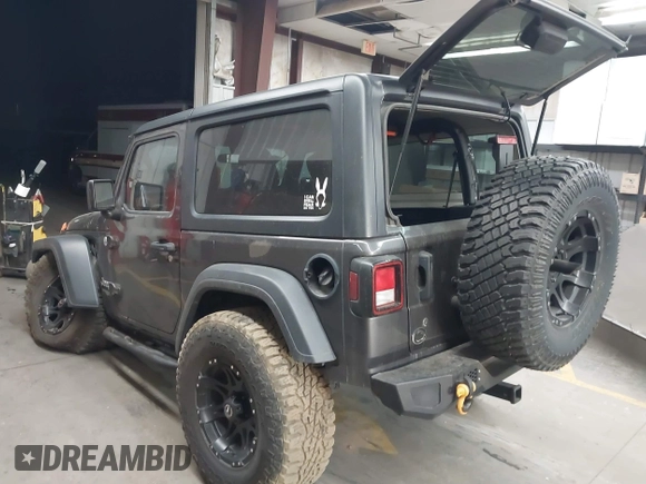 2020 Jeep Wrangler Sport S with VIN 1C4GJXAN4LW229040, listed as a IAAI auction lot 42172180 with 58,701 mi miles and . Bid and sale history available at DreamBid. Image 3.