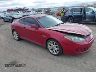 2007 Hyundai Tiburon GT z VIN KMHHN66F67U251509, wystawiony jako IAAI lot #42115300 z przebiegiem 180 334 mil mil oraz . Historia ofert i sprzedaży dostępna na DreamBid. Obrazek 1.
