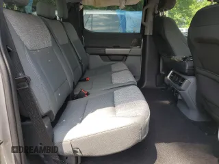 2023 Ford F-150 Lightning Pro z VIN 1FTVW1EL3PWG61686, wystawiony jako Copart lot #61353535 z przebiegiem 8 116 mil mil oraz Szkoda całkowita • Salvage title. Historia ofert i sprzedaży dostępna na DreamBid. Obrazek 10.