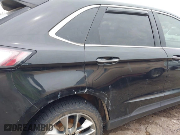2015 Ford Edge Titanium z VIN 2FMTK4K88FBC26324, wystawiony jako IAAI lot #42156964 z przebiegiem Nie podano mil oraz . Historia ofert i sprzedaży dostępna na DreamBid. Obrazek 6.