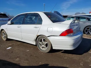 2003 Mitsubishi Lancer OZ-Rally with VIN JA3AJ86E13U100350, listed as a IAAI auction lot 41584874 with 244,945 mi miles. Bid and sale history available at carsss.com. Image 6.