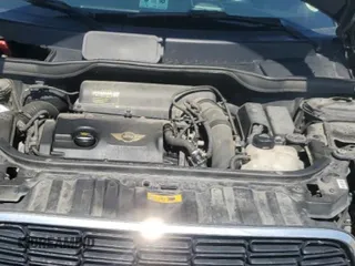 2013 MINI Countryman S ALL4 z VIN WMWZC5C54DWP34353, wystawiony jako Copart lot #57059295 z przebiegiem 154 012 mil mil oraz Szkoda całkowita • Salvage title. Historia ofert i sprzedaży dostępna na DreamBid. Obrazek 11.