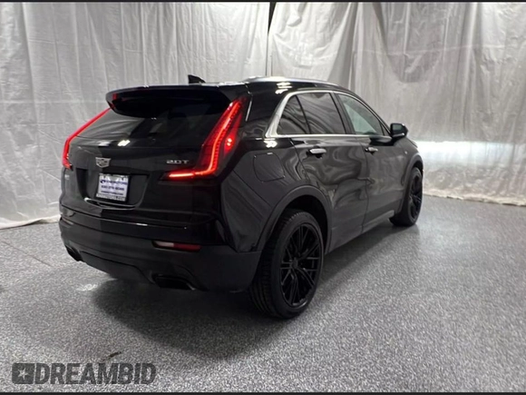 2019 Cadillac XT4 FWD Premium Luxury with VIN 1GYFZCR45KF142250, listed as a Copart auction lot 63934705 with 92,410 mi miles and Clean title. Bid and sale history available at DreamBid. Image 4.