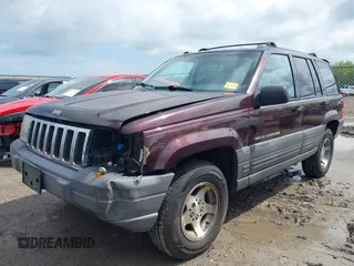 1997 Jeep Grand Cherokee Laredo with VIN 1J4GZ58S4VC702040, listed as a IAAI auction lot 42165536 with 121,803 mi miles and . Bid and sale history available at DreamBid. Image 2.