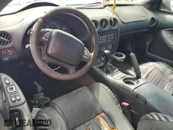 2000 Pontiac Firebird Formula z VIN 2G2FV22G9Y2140113, wystawiony jako Copart lot #76135324 z przebiegiem Nie podano mil oraz Szkoda całkowita • Salvage title. Historia ofert i sprzedaży dostępna na DreamBid. Obrazek 8.