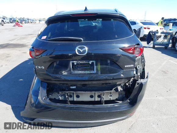 2021 Mazda CX-5 Touring with VIN JM3KFACM2M0339349, listed as a IAAI auction lot 41651005 with 53,792 mi miles. Bid and sale history available at carsss.com. Image 16.