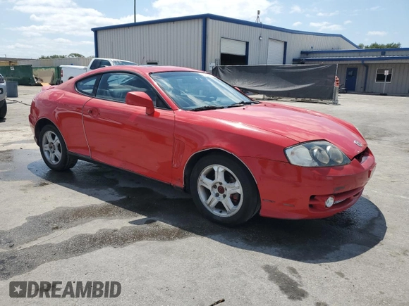2003 Hyundai Tiburon GT z VIN KMHHN65F33U088538, wystawiony jako Copart lot #54320955 z przebiegiem 220 732 mil mil oraz Szkoda całkowita • Salvage title. Historia ofert i sprzedaży dostępna na DreamBid. Obrazek 4.