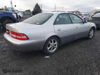 2000 Lexus ES 300 with VIN JT8BF28G9Y5088953, listed as a IAAI auction lot 41206922 with 254,063 mi miles. Bid and sale history available at carsss.com. Image 4.