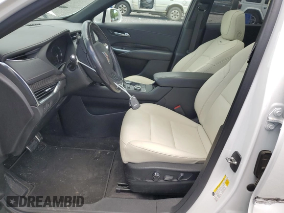 2019 Cadillac XT4 FWD Sport with VIN 1GYFZER44KF210582, listed as a Copart auction lot 61272015 with 104,073 mi miles and Salvage title. Bid and sale history available at DreamBid. Image 7.