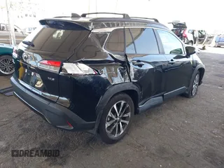 2023 Toyota Corolla Cross XLE with VIN 7MUDAAAG8PV072030, listed as a IAAI auction lot 42397573 with 6,584 mi miles and . Bid and sale history available at DreamBid. Image 4.
