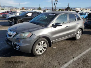 2010 Acura RDX with VIN 5J8TB2H28AA001810, listed as a Copart auction lot 82138994 with 128,499 mi miles and Salvage Title. Bid and sale history available at carsss.com. Image 1.