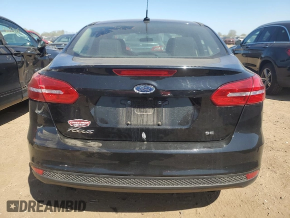 2017 Ford Focus SE z VIN 1FADP3F24HL316007, wystawiony jako Copart lot #56416645 z przebiegiem 79 085 mil mil oraz Szkoda całkowita • Salvage title. Historia ofert i sprzedaży dostępna na DreamBid. Obrazek 6.