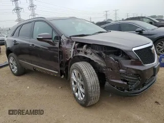 2021 Cadillac XT5 AWD Sport with VIN 1GYKNGRS2MZ142286, listed as a Copart auction lot 60699515 with 17,406 mi miles and Salvage title. Bid and sale history available at DreamBid. Image 4.