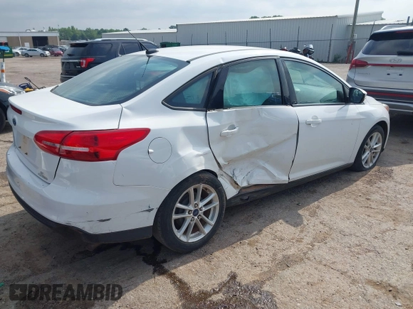 2015 Ford Focus SE with VIN 1FADP3F22FL376042, listed as a IAAI auction lot 42283236 with 76,675 mi miles and . Bid and sale history available at DreamBid. Image 4.