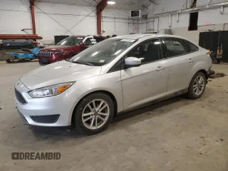 2018 Ford Focus SE z VIN 1FADP3F24JL315154, wystawiony jako Copart lot #53609185 z przebiegiem 76 216 mil mil oraz Szkody całkowita. Historia ofert i sprzedaży dostępna na DreamBid. Obrazek 1.