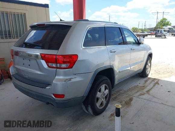 2011 Jeep Grand Cherokee Laredo with VIN 1J4RR4GG3BC540655, listed as a IAAI auction lot 42158522 with 214,341 mi miles and . Bid and sale history available at DreamBid. Image 4.