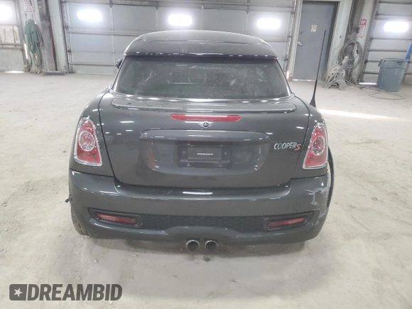 2012 MINI Coupe S z VIN WMWSX3C51CT408195, wystawiony jako Copart lot #77008744 z przebiegiem Nie podano mil oraz Szkody całkowita. Historia ofert i sprzedaży dostępna na DreamBid. Obrazek 6.