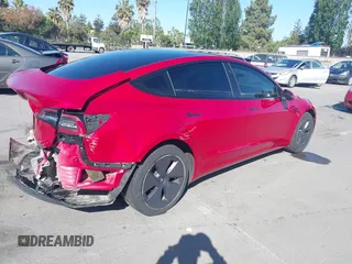 2023 Tesla Model 3 with VIN 5YJ3E1EA1PF385490, listed as a IAAI auction lot 42315884 with 17,590 mi miles and . Bid and sale history available at DreamBid. Image 4.