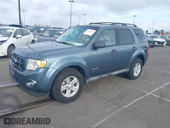 2012 Ford Escape Hybrid z VIN 1FMCU5K36CKB12795, wystawiony jako IAAI lot #41870941 z przebiegiem 91 570 mil mil oraz . Historia ofert i sprzedaży dostępna na DreamBid. Obrazek 2.