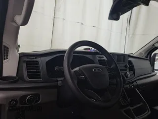 2023 Ford Transit Cargo with VIN 1FTBW3U84PKB20116, listed as a IAAI auction lot 42748031 with 6,591 mi miles and . Bid and sale history available at DreamBid. Image 10.