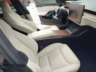 2022 Tesla Model S with VIN 5YJSA1E51NF472152, listed as a IAAI auction lot 42625943 with 60,290 mi miles and . Bid and sale history available at DreamBid. Image 5.