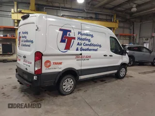 2021 Ford Transit Cargo with VIN 1FTBR1C82MKA29712, listed as a IAAI auction lot 41463781 with 83,961 mi miles and . Bid and sale history available at DreamBid. Image 4.