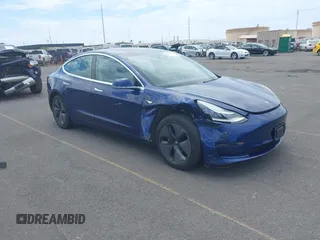2018 Tesla Model 3 Long Range Battery z VIN 5YJ3E1EA6JF160859, wystawiony jako IAAI lot #42149636 z przebiegiem 81 159 mil mil oraz . Historia ofert i sprzedaży dostępna na DreamBid. Obrazek 1.