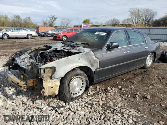 1999 Lincoln Town Car Executive z VIN 1LNHM81W0XY644873, wystawiony jako Copart lot #52865095 z przebiegiem Nie podano mil oraz Szkoda całkowita • Salvage title. Historia ofert i sprzedaży dostępna na DreamBid. Obrazek 1.
