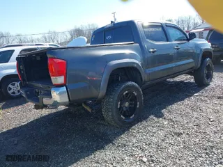 2016 Toyota Tacoma SR with VIN 3TMCZ5AN0GM015471, listed as a IAAI auction lot 41660876 with 81,031 mi miles. Bid and sale history available at carsss.com. Image 4.