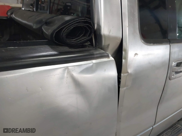 2005 Ford F-150 XL with VIN 1FTRF12W15NA18935, listed as a IAAI auction lot 41942570 with 152,708 mi miles. Bid and sale history available at carsss.com. Image 12.