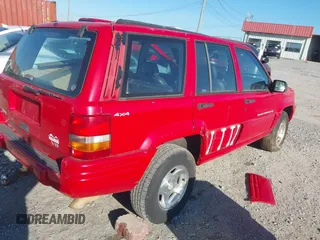 1998 Jeep Grand Cherokee Laredo with VIN 1J4GZ48Y6WC290798, listed as a IAAI auction lot 41816161 with 299,875 mi miles. Bid and sale history available at carsss.com. Image 4.