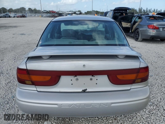 2000 Saturn SL z VIN 1G8ZK5276YZ224500, wystawiony jako Copart lot #45083945 z przebiegiem 130 766 mil mil oraz Szkoda całkowita • Salvage title. Historia ofert i sprzedaży dostępna na DreamBid. Obrazek 6.