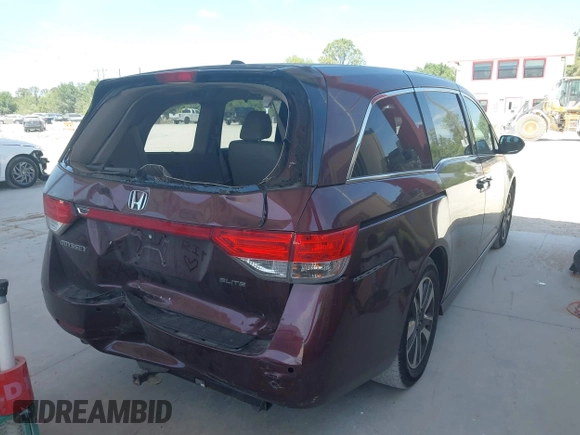 2014 Honda Odyssey Touring with VIN 5FNRL5H90EB080889, listed as a IAAI auction lot 42085305 with 123,286 mi miles and . Bid and sale history available at carsss.com. Image 4.