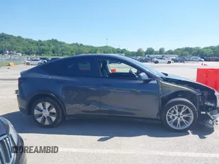 2023 Tesla Model Y Long Range with VIN 7SAYGDEE4PA037218, listed as a IAAI auction lot 42232704 with 18,756 mi miles and . Bid and sale history available at DreamBid. Image 14.