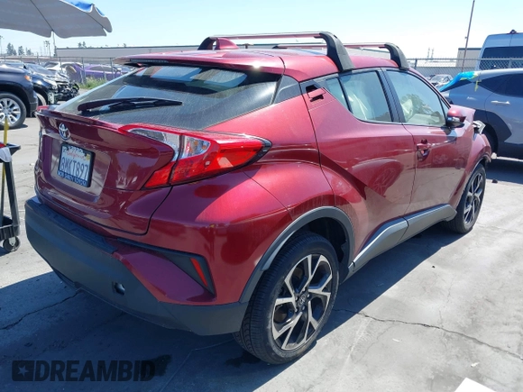 2019 Toyota C-HR XLE with VIN JTNKHMBX1K1060316, listed as a IAAI auction lot 41764464 with 42,956 mi miles. Bid and sale history available at carsss.com. Image 4.