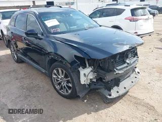 2017 Mazda CX-9 Grand Touring z VIN JM3TCADY5H0129798, wystawiony jako IAAI lot #42079754 z przebiegiem 128 403 mil mil oraz . Historia ofert i sprzedaży dostępna na DreamBid. Obrazek 1.
