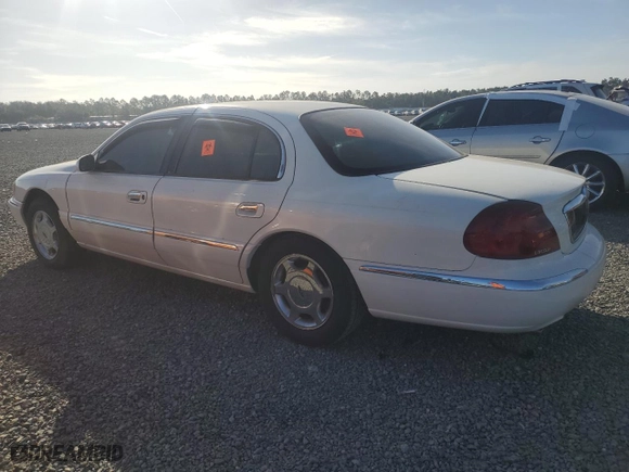 2000 Lincoln Continental with VIN 1LNHM97V0YY795279, listed as a Copart auction lot 76456684 with 0 mi miles and Salvage Title. Bid and sale history available at carsss.com. Image 2.