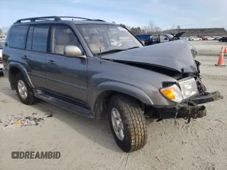 2000 Toyota Land Cruiser with VIN JT3HT05J3Y0088425, listed as a Copart auction lot 41387034 with 243,408 mi miles and Salvage Title. Bid and sale history available at carsss.com. Image 4.
