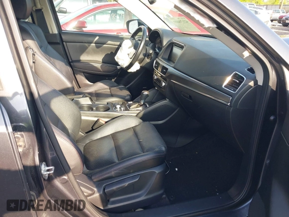 2016 Mazda CX-5 Grand Touring with VIN JM3KE4DYXG0724183, listed as a IAAI auction lot 42176009 with 152,695 mi miles and . Bid and sale history available at DreamBid. Image 5.