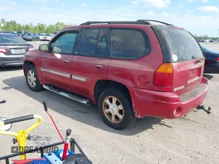 2004 GMC Envoy SLT with VIN 1GKDS13SX42334503, listed as a IAAI auction lot 42038781 with 242,680 mi miles. Bid and sale history available at carsss.com. Image 3.