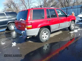 1996 Jeep Grand Cherokee Laredo with VIN 1J4GZ58Y8TC374929, listed as a IAAI auction lot 41725111 with 196,723 mi miles. Bid and sale history available at carsss.com. Image 4.
