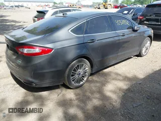 2015 Ford Fusion SE z VIN 3FA6P0H98FR275848, wystawiony jako IAAI lot #42311852 z przebiegiem 197 536 mil mil oraz . Historia ofert i sprzedaży dostępna na DreamBid. Obrazek 4.