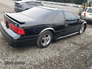 1997 Ford Thunderbird LX with VIN 1FALP62W1VH110468, listed as a Copart auction lot 88331705 with 84,349 mi miles and Salvage Title. Bid and sale history available at DreamBid. Image 3.